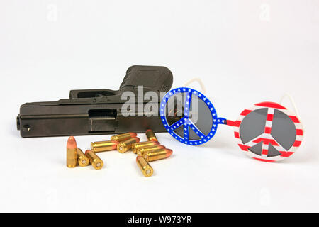 Glock 19 9mm semi-automatic hand gun with a pair of Peace and Love Sun glasses Stock Photo