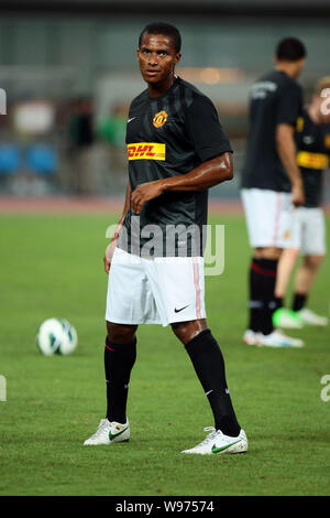 Antonio Valencia of Manchester United warms up with teammates before their friendly soccer match against Shanghai Shenhua during the pre-season tour o Stock Photo