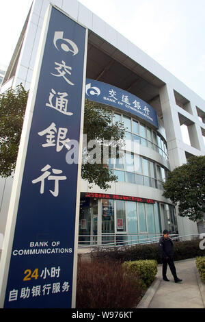 --File--A pedestrian walks past a branch of Bank of Communications (BoCom) in Shanghai, China, 12 March 2012.   Bank of Communications Corp., the coun Stock Photo