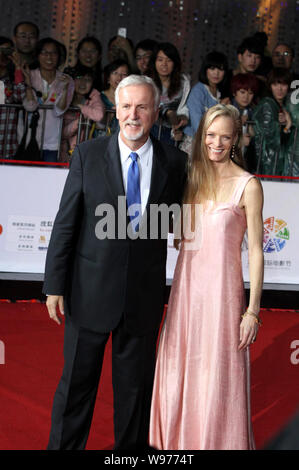 Canadian film director and producer James Cameron and his wife Suzy Amis are pictured on the red carpet ahead of the opening ceremony for the 2nd Beij Stock Photo