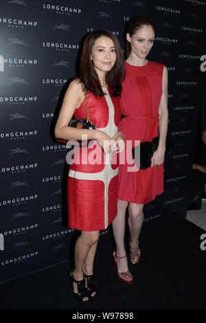 Chinese actress Gao Yuanyuan, left, and Canadian model Coco Rocha pose at the opening ceremony of a new store of French fashion house Longchamp in Hon Stock Photo