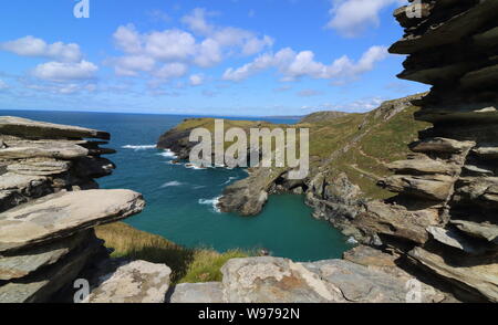 Tintagel, Cornwall, UK. 12th Aug, 2019. View of the Cornish coast during the opening of the new footbridge re-connecting both halves of Tintagel Castle for the first time in 500 years. The medieval castle on the Cornwall coast - long rumoured to be the site of King Arthur's legendary Camelot - lost its original bridge sometime between the 15th and 16th centuries. A storm which hit the Cornish coast delayed the bridge's opening. Credit: Keith Mayhew/SOPA Images/ZUMA Wire/Alamy Live News Stock Photo