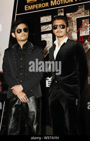 Taiwanese singer and actor Jay Chou and Hong Kong singer and actor Nicholas Tse pose during a premiere ceremony for the new movie, The Viral Factor, i Stock Photo