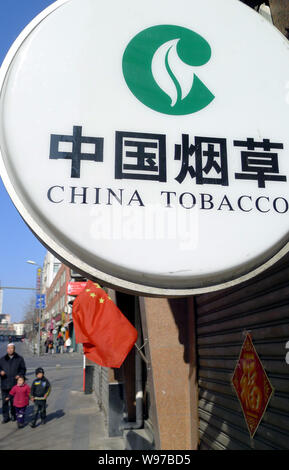 china national tobacco corporation FILE--Pedestrians walk past a branch of China National Tobacco Corporation, known as China Tobacco, in Qingdao city, east Chinas Shandong province Stock Photo china national tobacco corporation FILE--Pedestrians walk past a branch of China National Tobacco Corporation, known as China Tobacco, in Qingdao city, east Chinas Shandong province Stock Photo