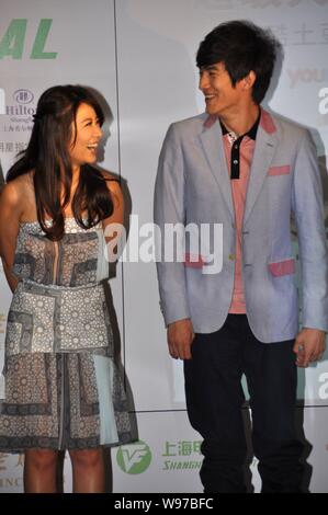 Taiwanese actress Ruby Lin and Chinese actor Lin Gengxin giggles during the press conference for a new micro movie in Shanghai, China, 12 June 2012. Stock Photo