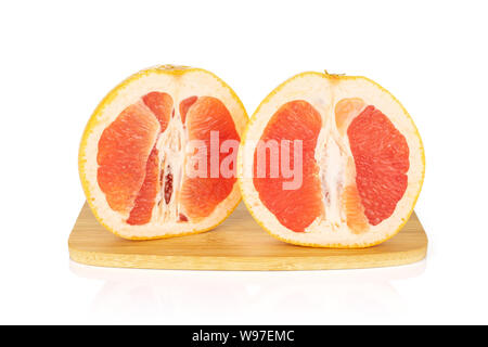 Group of two halves of fresh pink grapefruit on bamboo cutting board isolated on white background Stock Photo