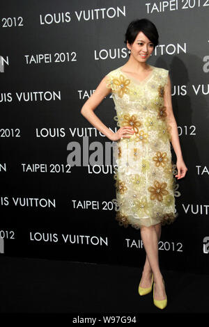 Yves Carcelle, left, Chairman and CEO of Louis Vuitton, poses with  Taiwanese model Patina Lin during the opening ceremony of a Louis Vuitton  store in Stock Photo - Alamy