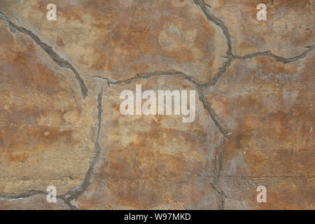 Old tan marbled wall background image with cracks Stock Photo