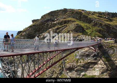 View of the controversial new footbridge re-connecting both halves of Tintagel Castle for the first time in 500 years, has at long last been opened. The medieval castle on the Cornwall coast - long rumoured to be the site of King Arthur's legendary Camelot - lost its original bridge sometime between the 15th and 16th centuries. A storm which hit the Cornish coast delayed the bridge's opening. Stock Photo