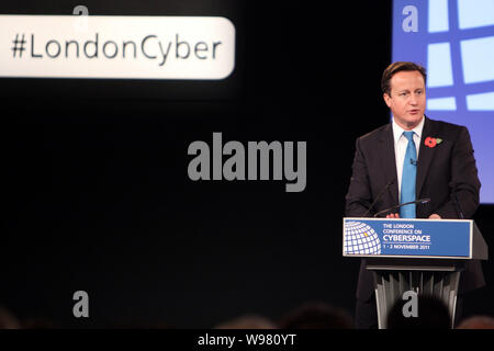 British Prime Minister David Cameron delivers a speech at the London Conference on Cyberspace at the entrance to the Queen Elizabeth II Conference Cen Stock Photo