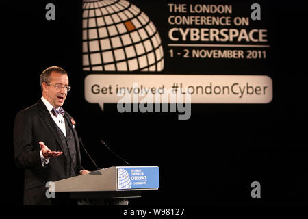 Toomas Hendrik Ilves, President of Estonia, delivers a speech at the London Conference on Cyberspace at the entrance to the Queen Elizabeth II Confere Stock Photo