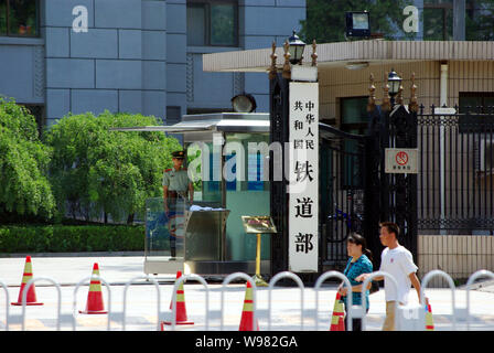 --FILE--Local residents walk past the Ministry of Railways in Beijing, China, 26 July 2011.   Chinas debt-laden Ministry of Railways has reportedly as Stock Photo