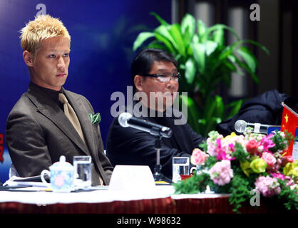 Japanese football player Keisuke Honda, left, and Chinese football coach Xu Genbao attend a press conference for the China-Japan Youth Football Exchan Stock Photo