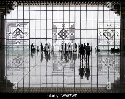 People visit the Nanjing South Railway Station, part of the Beijing-Shanghai High-speed Railway project, in Nanjing city, east Chinas Jiangsu province Stock Photo