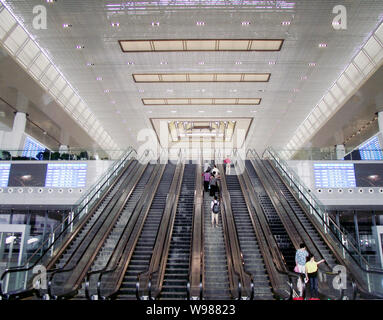 People visit the Nanjing South Railway Station, part of the Beijing-Shanghai High-speed Railway project, in Nanjing city, east Chinas Jiangsu province Stock Photo