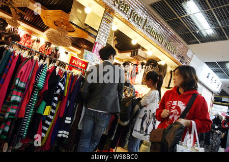 FILE--Chinese customers shop for clothes on sale during a promotional event  at a shopping mall in Beijing, China, 7 November 2009. The National Bu  Stock Photo - Alamy