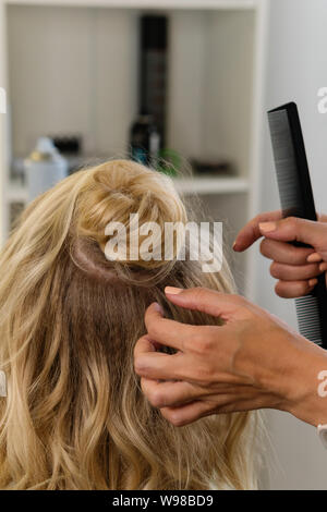 Hairtician Builds Upper Bun Hairstyle On Bob Hairdressing