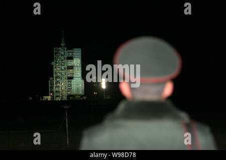 A paramilitary policeman stands guard near the launch pad before the blast-off of a Long March 2F (CZ-2F) carrier rocket carrying the Shenzhou VIII (S Stock Photo