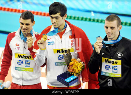 (From left) Bronze medalist Gergo Kis of Hungary, gold medalist Sun Yang of China and silver medalist Ryan Cochrane of Canada show their medals after Stock Photo