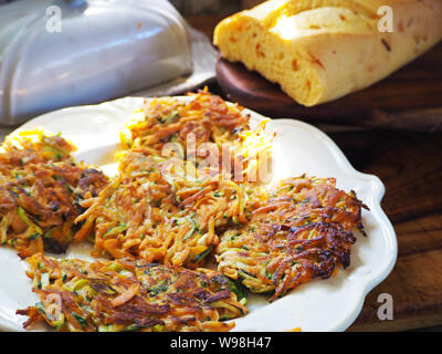 Healthy vegetarian meat free burgers on round chopping board with vegetables  and spinach on light background Stock Photo - Alamy