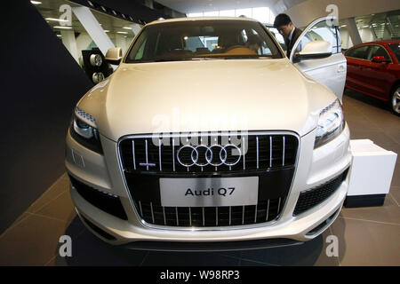 --FILE--A Chinese car buyer tries out the Audi Q7 at an Audi dealership in Shanghai, China, 5 January 2011.   Audi, a luxury car unit of German automa Stock Photo