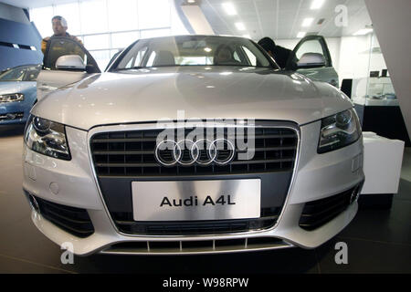 --FILE--A Chinese car buyer tries out the Audi A4L at an Audi dealership in Shanghai, China, 5 January 2011.   Audi, a luxury car unit of German autom Stock Photo