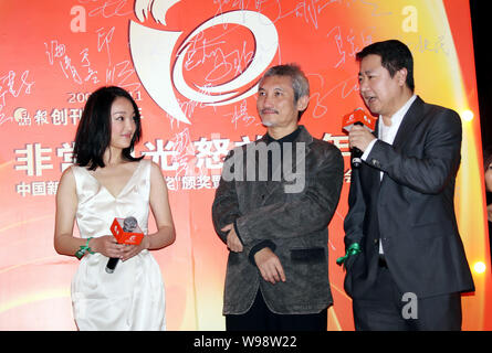 (From left) Chinese actress Zhou Xun, Hong Kong director Hark Tsui and Yu Dong, President of Bona Film Group Ltd., attend an award ceremony by Chinese Stock Photo