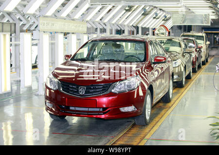 --FILE--SGMW (SAIC-GM-WULING) Baojun 630 cars pass through the assembly line at the auto plant of SGMW in Liuzhou city, south Chinas Guagnxi Zhuang Au Stock Photo