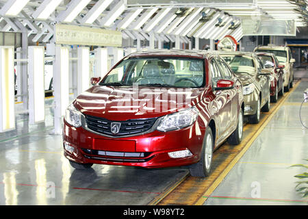 --FILE--SGMW (SAIC-GM-WULING) Baojun 630 cars go through the assembly line at the auto plant of SGMW in Liuzhou city, south Chinas Guagnxi Zhuang Auto Stock Photo