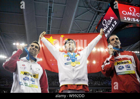 (From left) Bronze medalist Gergo Kis of Hungary, gold medalist Sun Yang of China and silver medalist Ryan Cochrane pose after the award ceremony for Stock Photo