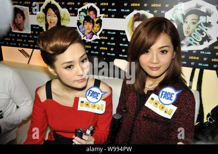 Singers and actresses Charlene Choi Cheuk-Yin, right, and Gillian Chung Yan-Tung of Hong Kong Cantopop duo Twins are interviewed at a trends event in Stock Photo