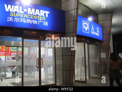 --File--Customers walk into a Walmart supermarket in Beijing, China, 23 April 2011.   Outlets of major international retailers Walmart and Carrefour i Stock Photo