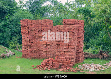 Inidan Red Clay Bricks Piles in Stacks. Stock Photo