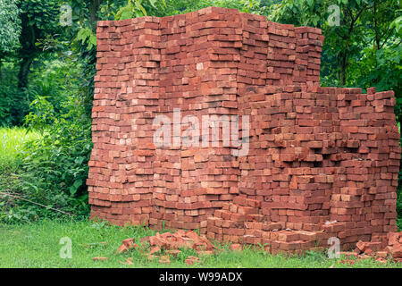 Inidan Red Clay Bricks Piles in Stacks. Stock Photo