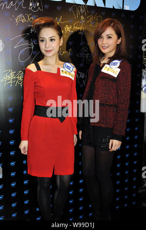 Singers and actresses Charlene Choi Cheuk-Yin, right, and Gillian Chung Yan-Tung of Hong Kong Cantopop duo Twins pose at a trends event in Hong Kong, Stock Photo