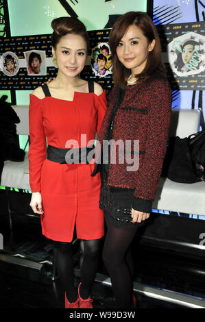 Singers and actresses Charlene Choi Cheuk-Yin, right, and Gillian Chung Yan-Tung of Hong Kong Cantopop duo Twins pose at a trends event in Hong Kong, Stock Photo