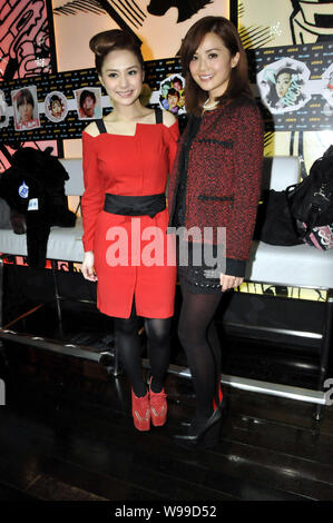 Singers and actresses Charlene Choi Cheuk-Yin, right, and Gillian Chung Yan-Tung of Hong Kong Cantopop duo Twins pose at a trends event in Hong Kong, Stock Photo