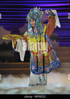 --File--A player dressed in the costume of dan, one of the 4 main characters in Beijing Opera, performs in Beijing, China, 9 September 2011.   Sun Pin Stock Photo