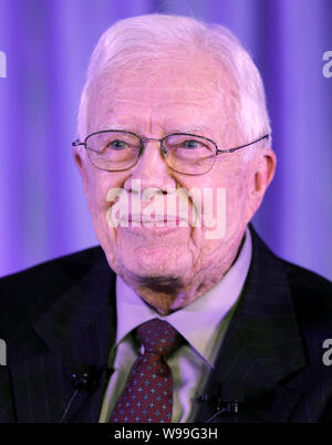 Former U.S. President Jimmy Carter reacts at the Caijing Annual Dialogue during the Caijing Annual Conference 2012 in Beijing, China, 14 December 2011