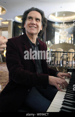 Peter Buffett, American musician, composer and author and second son of investor Warren Buffett, plays the piano during an interview for his new book, Stock Photo