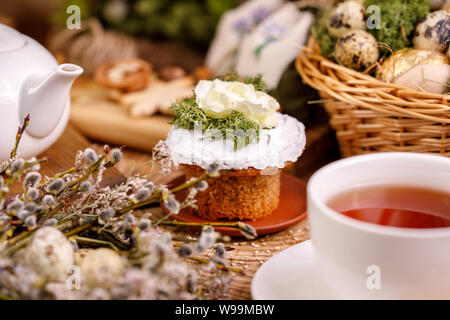 Easter composition with willow and willow lights with Easter eggs and traditional Easter cakes. Holiday concept.Easter still life. Stock Photo