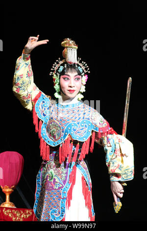 --File--A player dressed in the costume of dan, one of the 4 main characters in Beijing Opera, performs in a theater in Haikou, south Chinas Hainan pr Stock Photo