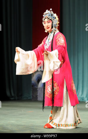 --File--A player dressed in the costume of dan, one of the 4 main characters in Beijing Opera, performs in a theater in Taipei, Taiwan, 19 April 2010. Stock Photo