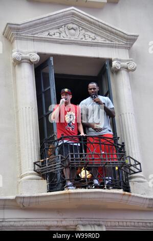 NBA star of Miami Heat LeBron James (R) is seen on a balcony of a century-old house during his China Tour in Shanghai, China, 17 August 2011. Stock Photo