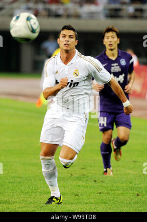 Cristiano Ronaldo of Real Madrid dribbles against Tianjin Teda during a friendly soccer match in Tianjin, China, 6 August 2011.   Real Madrid beat Tia Stock Photo