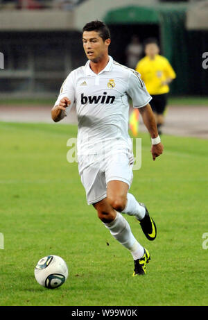 Cristiano Ronaldo of Real Madrid dribbles against Tianjin Teda during a friendly soccer match in Tianjin, China, 6 August 2011.   Real Madrid beat Tia Stock Photo