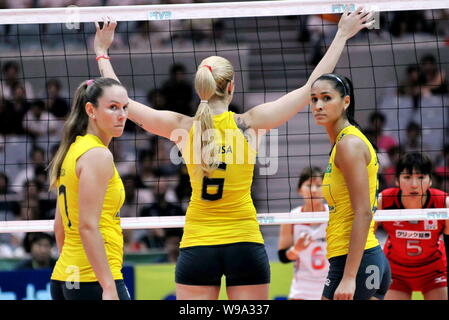 (From left) Josefa Fabiola de Souza, Thaisa Menezes and Jaqueline Carvalho of Brazil prepare while competing against Japan in a volleyball match of th Stock Photo