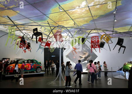 Visitors look at exhibits at the Italy Pavilion in the Expo site on the first day after the official opening of the World Expo 2010 in Shanghai, China Stock Photo