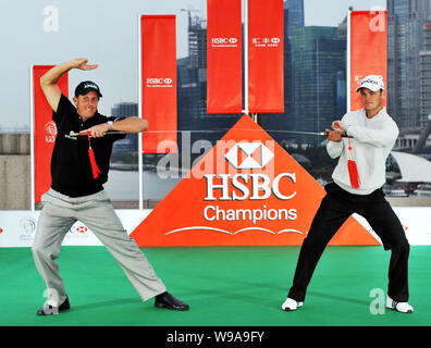 US golfer Phil Mickelson and German golfer Martin Kaymer practice the Tai Chi Sword at a press conference for the HSBC Golf Champions 2010 on the Bund Stock Photo