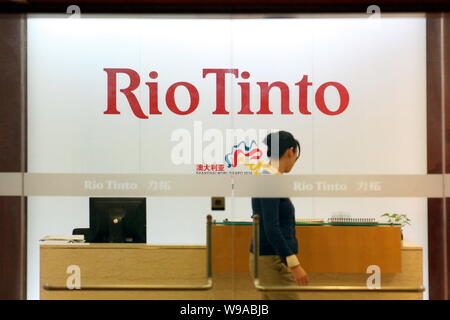 An Employee Walks Past The Front Desk At The Shanghai Office Of